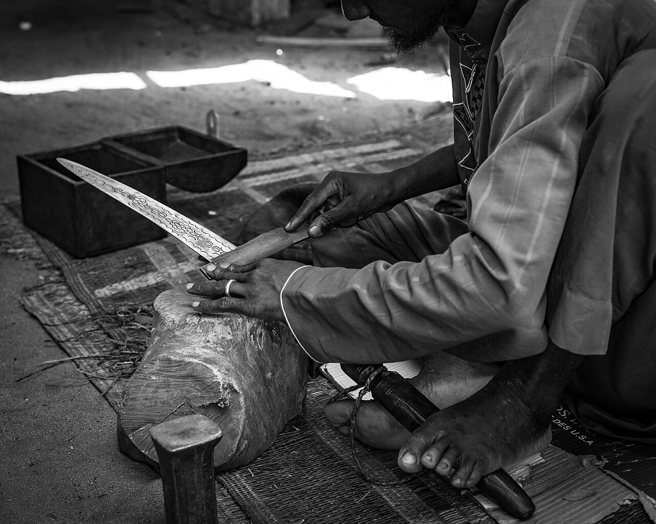 Metalsmith at work, Village Artisanal de Grand-Bassam, Côte d'Ivoire