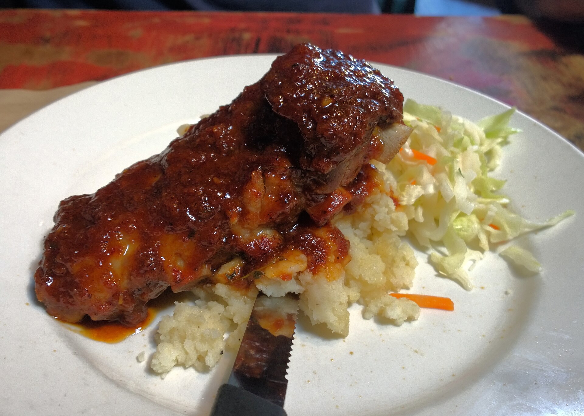 Jamaican jerk chicken cooking over pimento wood