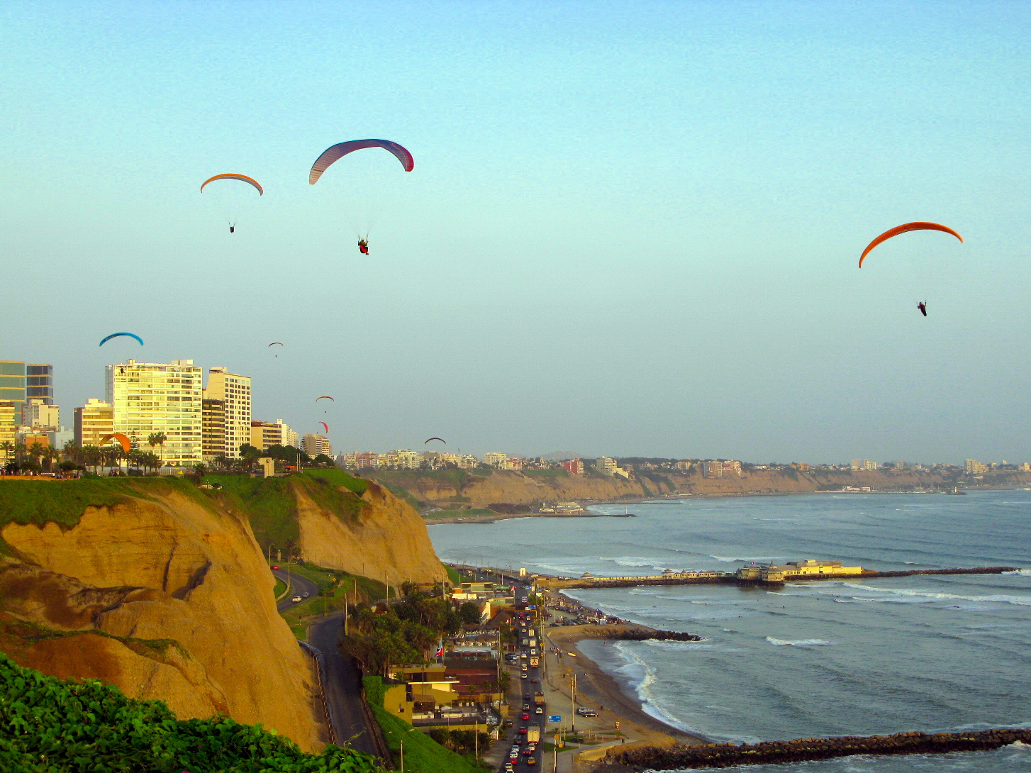 Paragliding over the Miraflores coastline, Lima, Peru