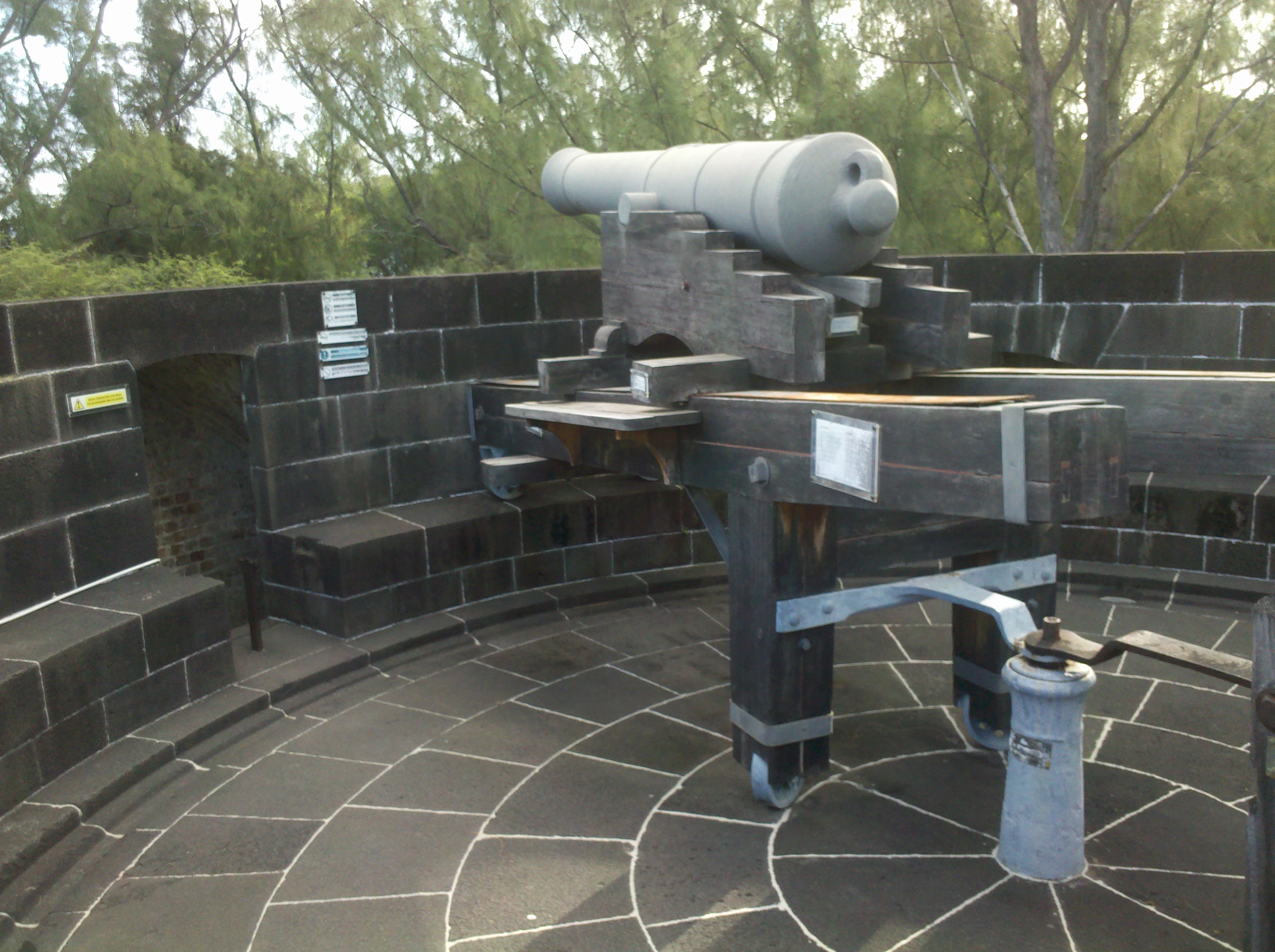 Historic cannon and the restored Martello Tower at La Preneuse, Mauritius