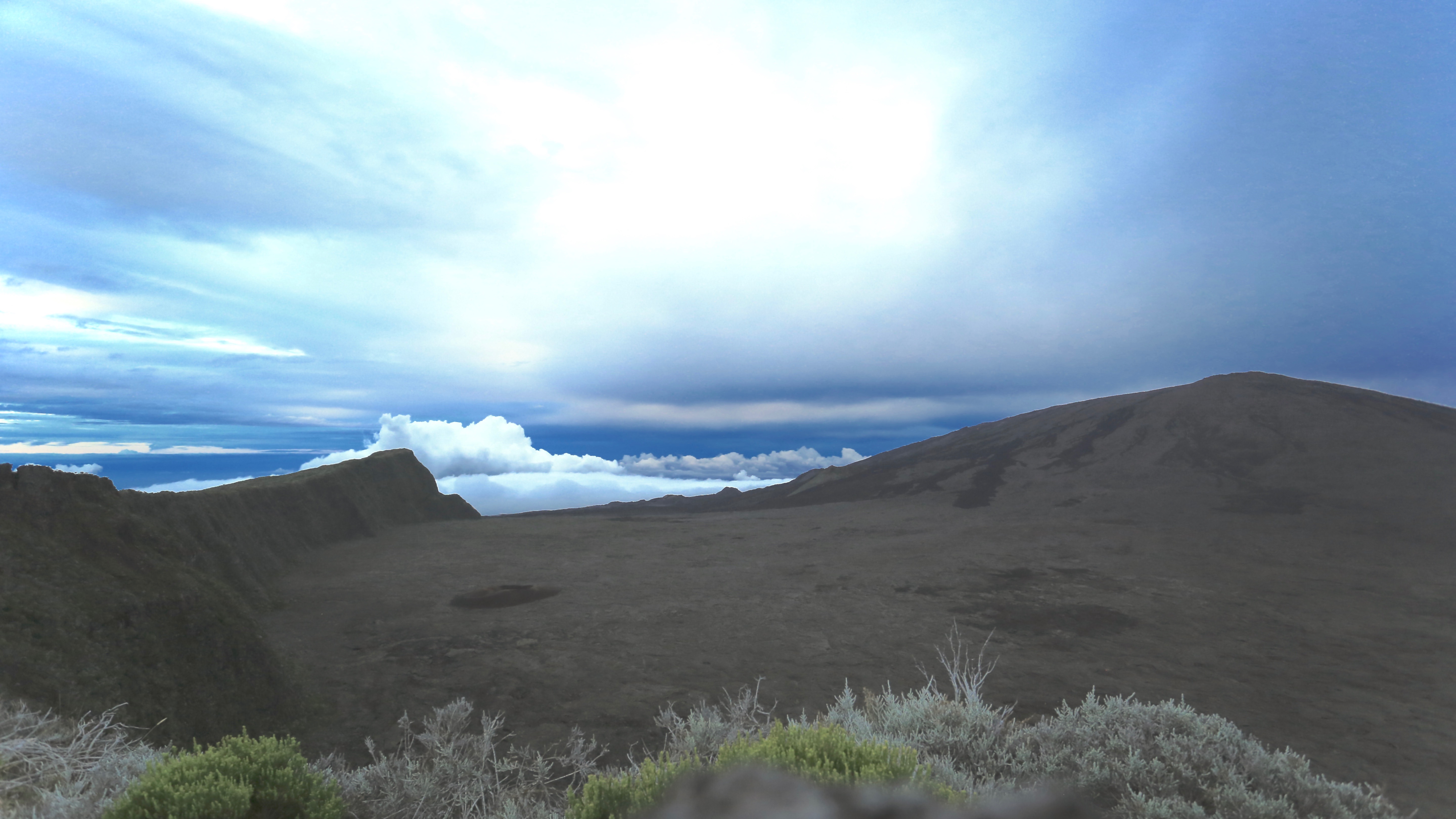 The volcanic slopes and crater landscape of Piton de la Fournaise, Réunion's active shield volcano
