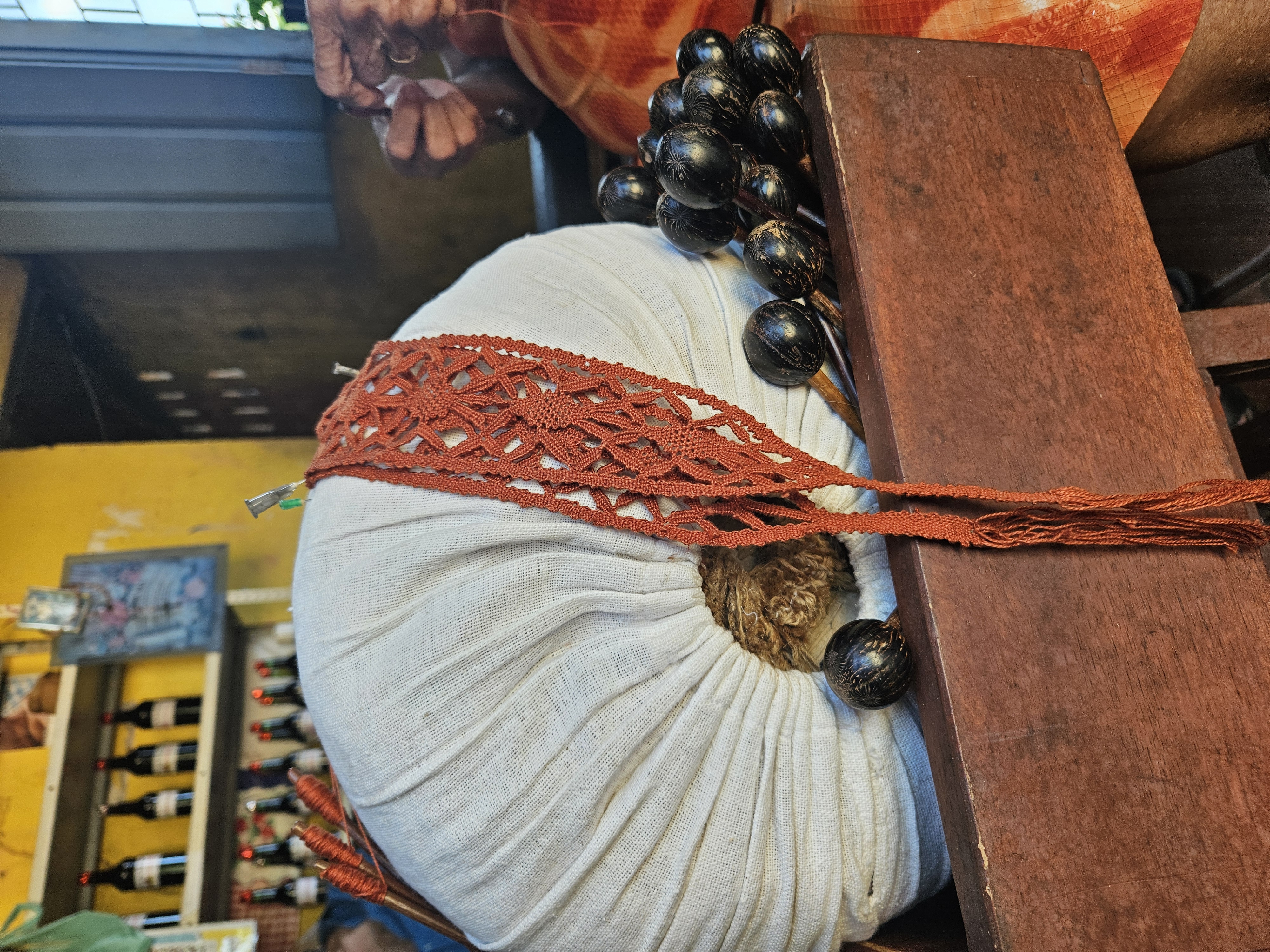 Bobbin-lace pillow, bobbins, and tiara — a traditional Azorean-Brazilian craft still practiced in Santa Catarina