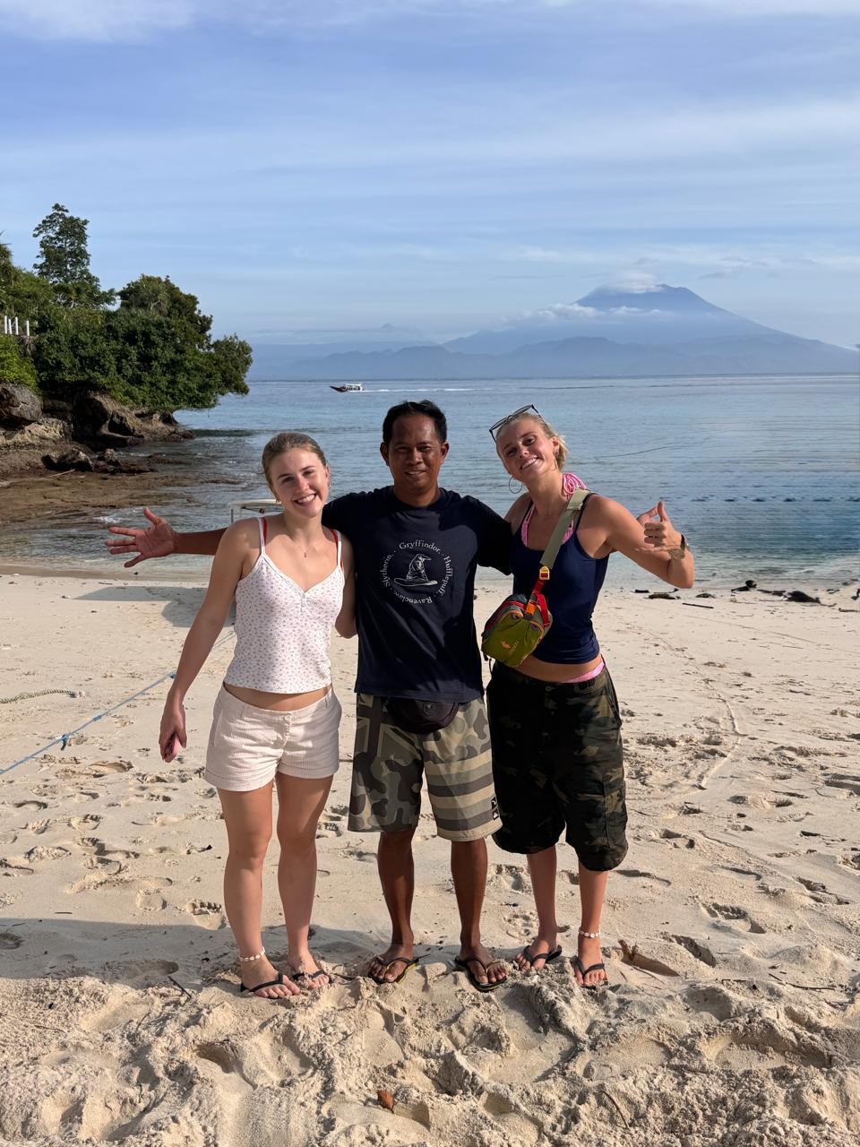 Wayan Dedi with a group of surf students on the beach