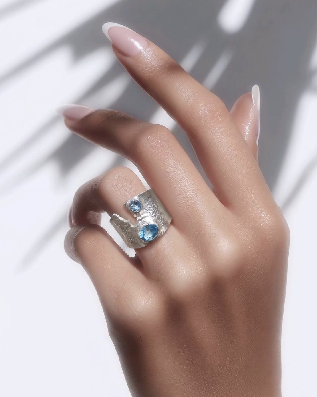 Coast handcrafted silver ring with blue stones