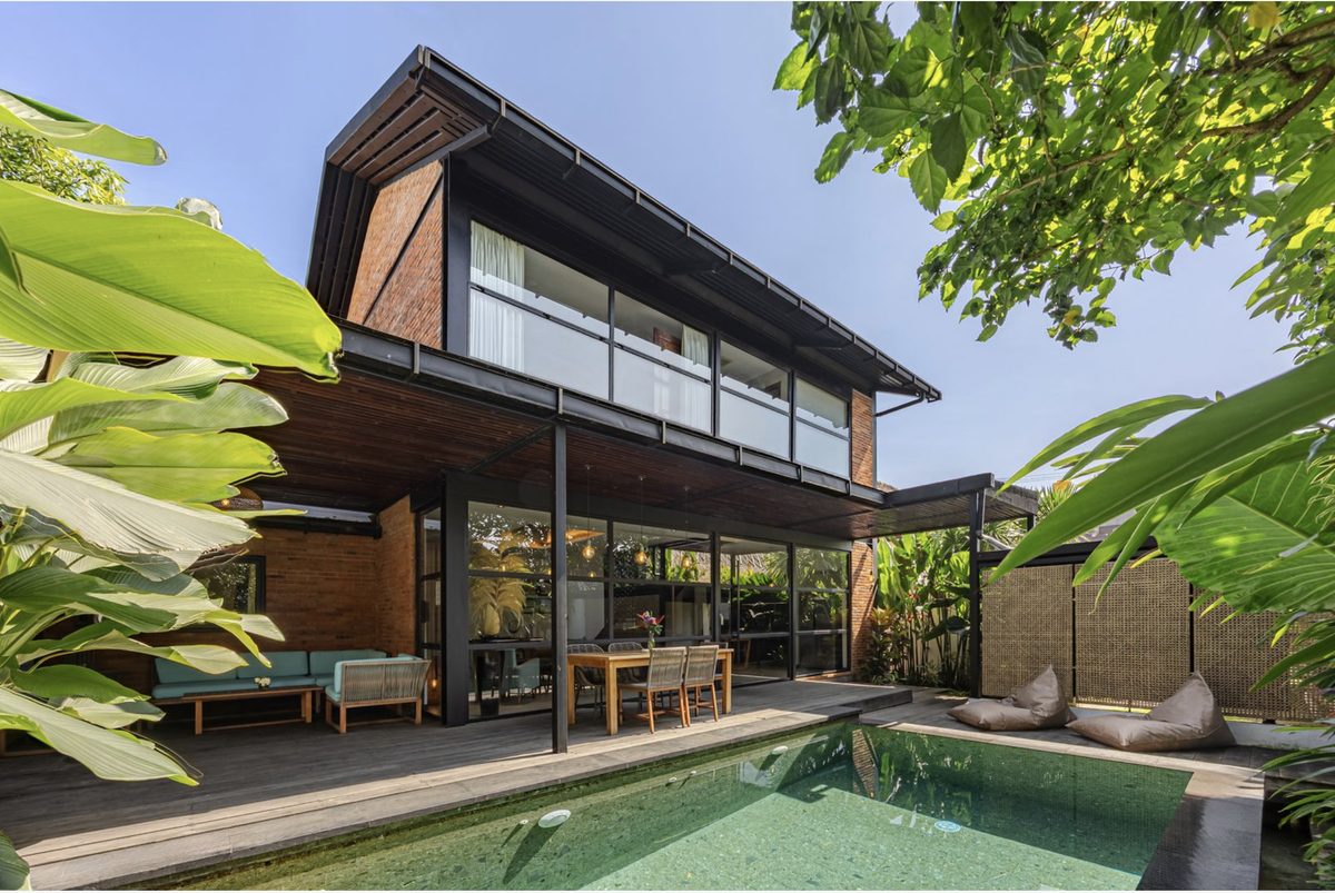 Karmagali villa exterior with pool deck and lounge seating
