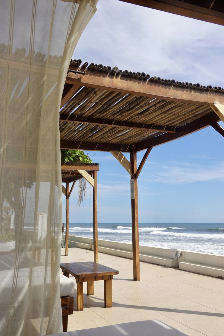 Sunset over Coco Surf's beachfront palapa deck