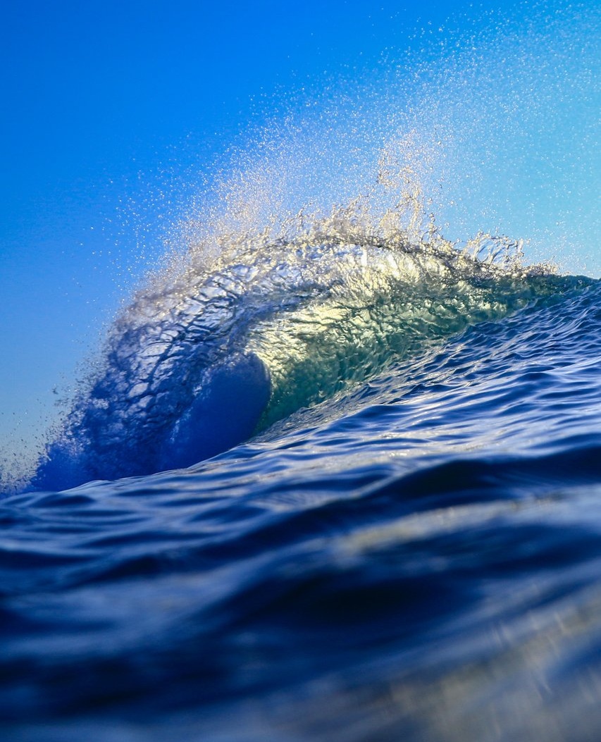 Close-up water shot of a breaking wave