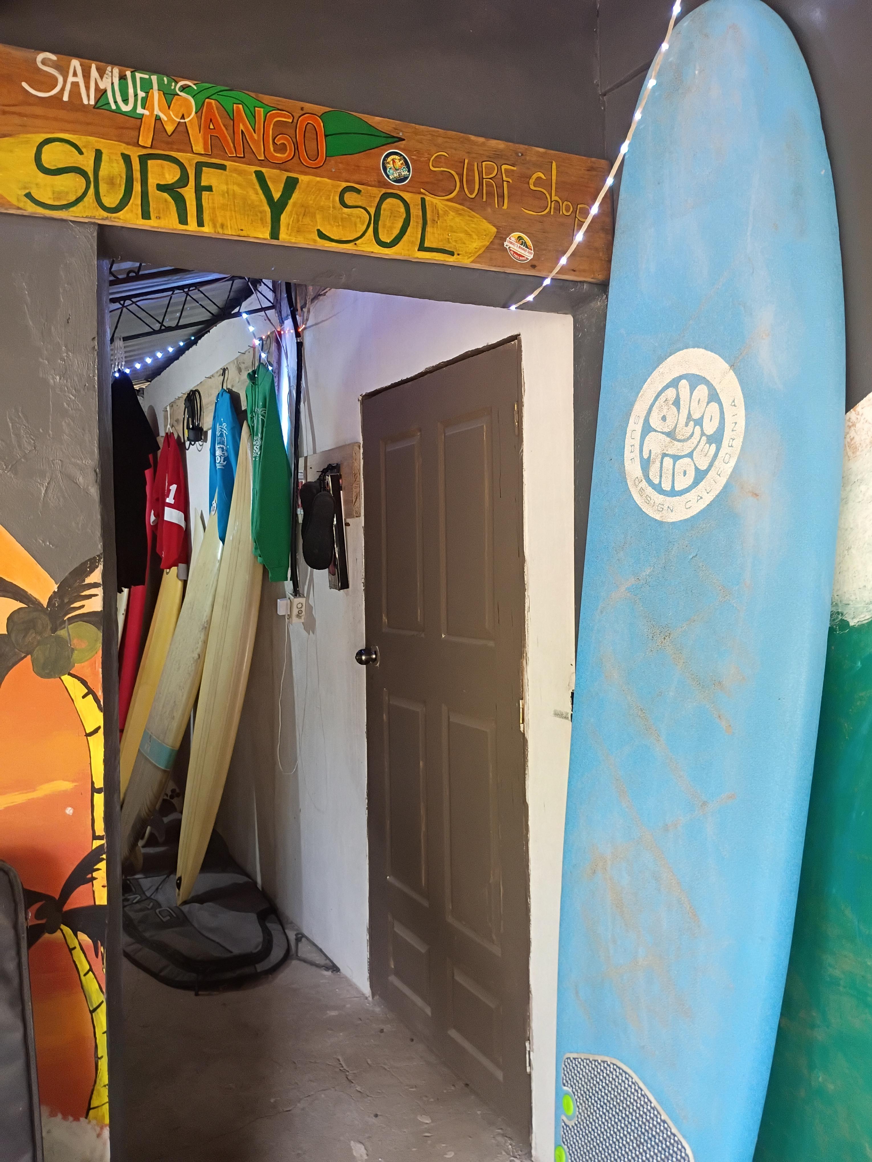 Inside Samuel's Mango Surf y Sol surf shop, boards and gear