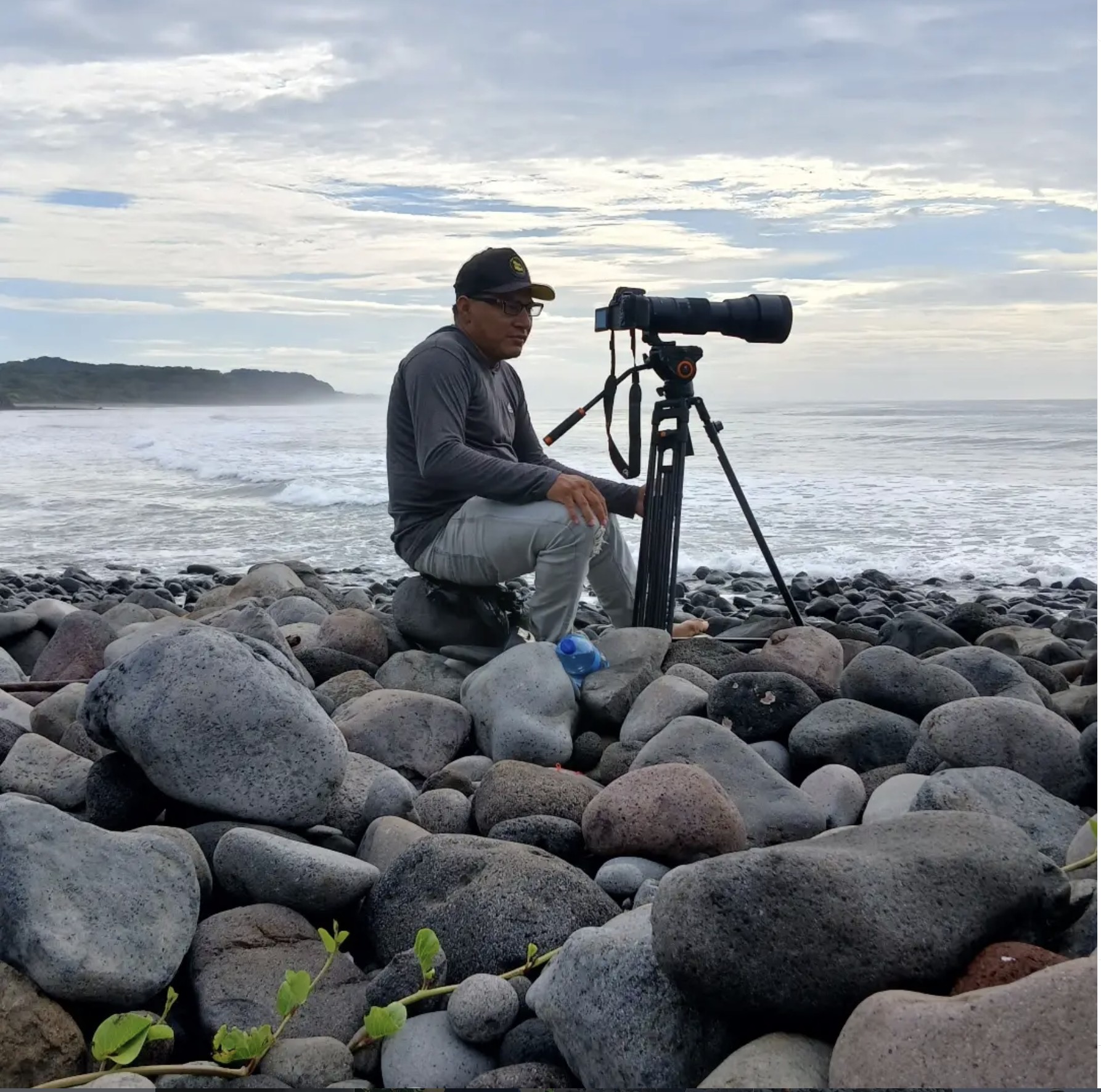 Ulise Hernandez filming from the rocks at Punta Mango, El Salvador