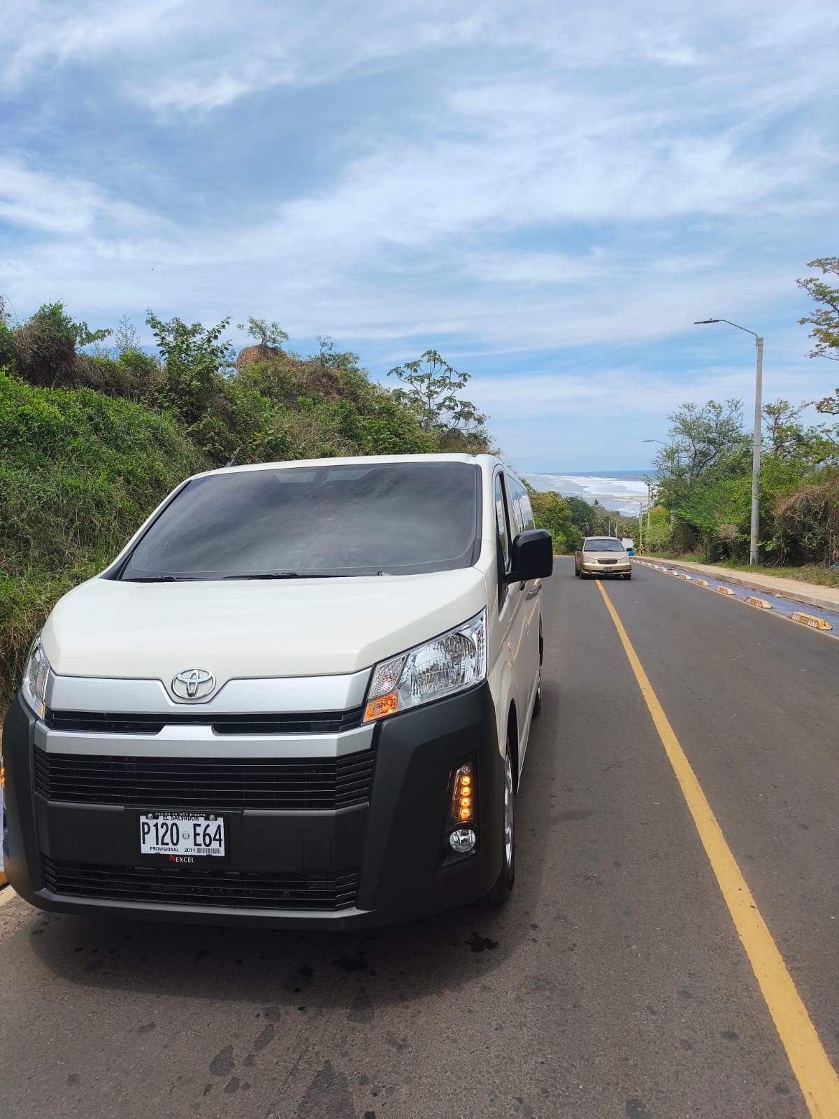 Toyota Hiace van on the coast road near Punta Mango