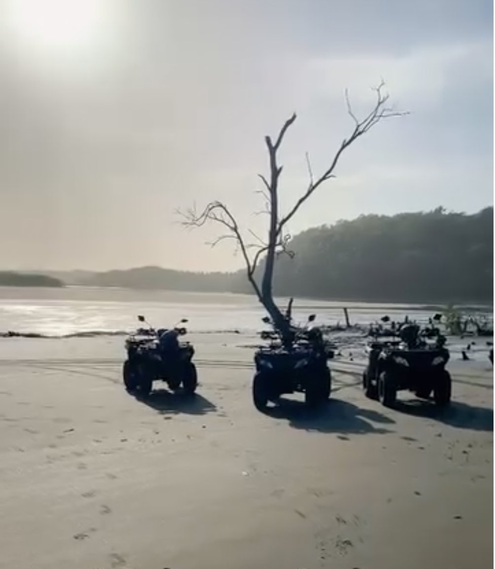 Three ATVs parked on the beach at the mangrove estuary near Punta Mango