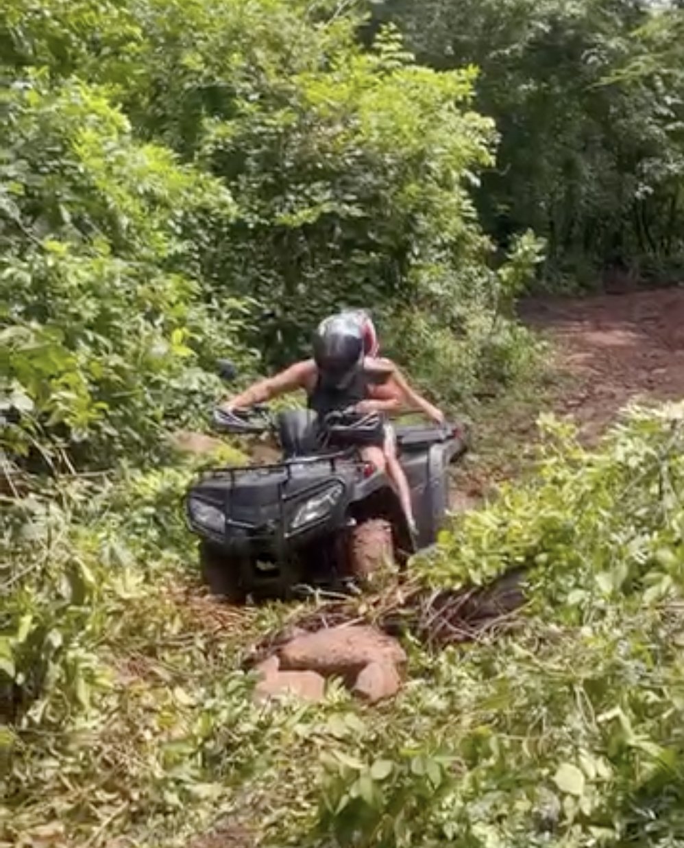 Rider on an ATV navigating a jungle trail near Punta Mango