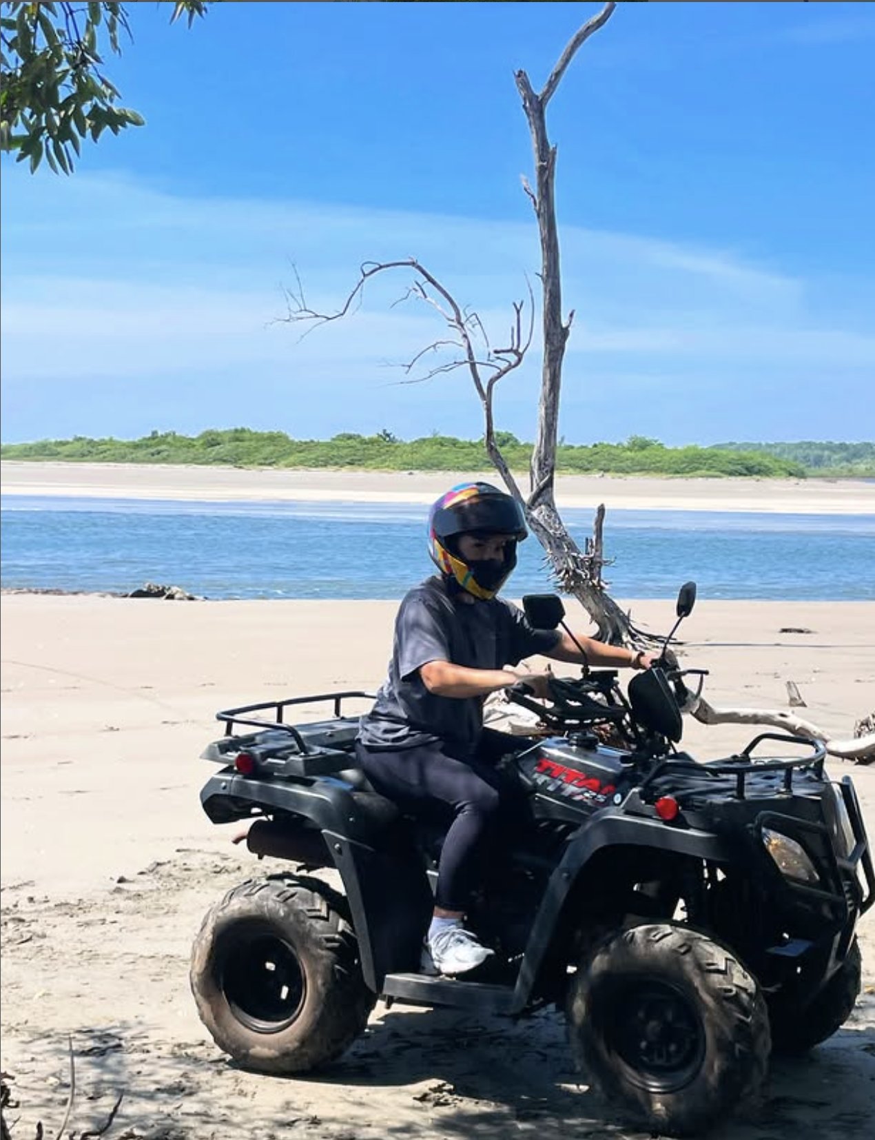 Rider on an ATV at the estuary near Punta Mango