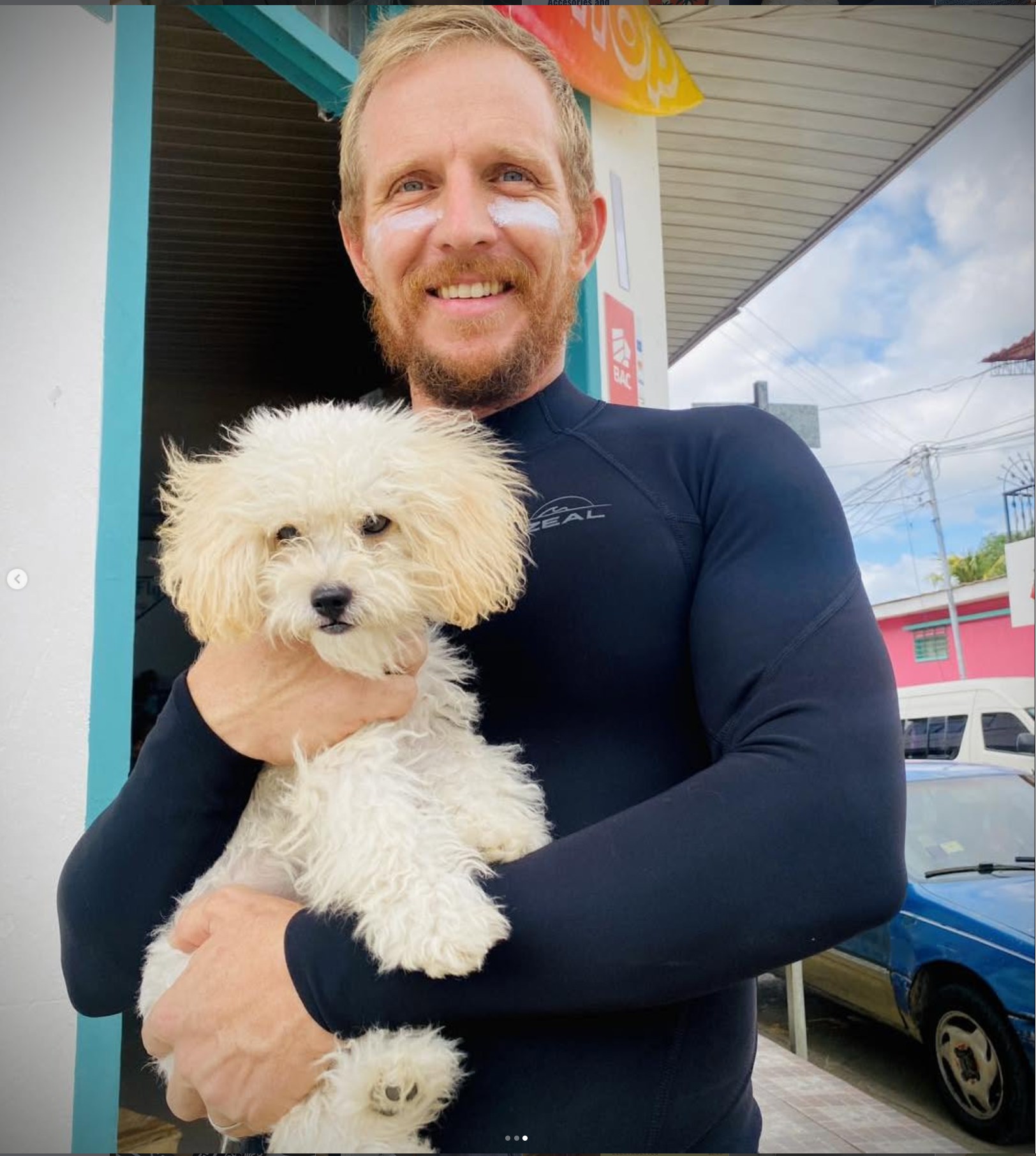 Ocean Fly Surf Shop owner outside the storefront