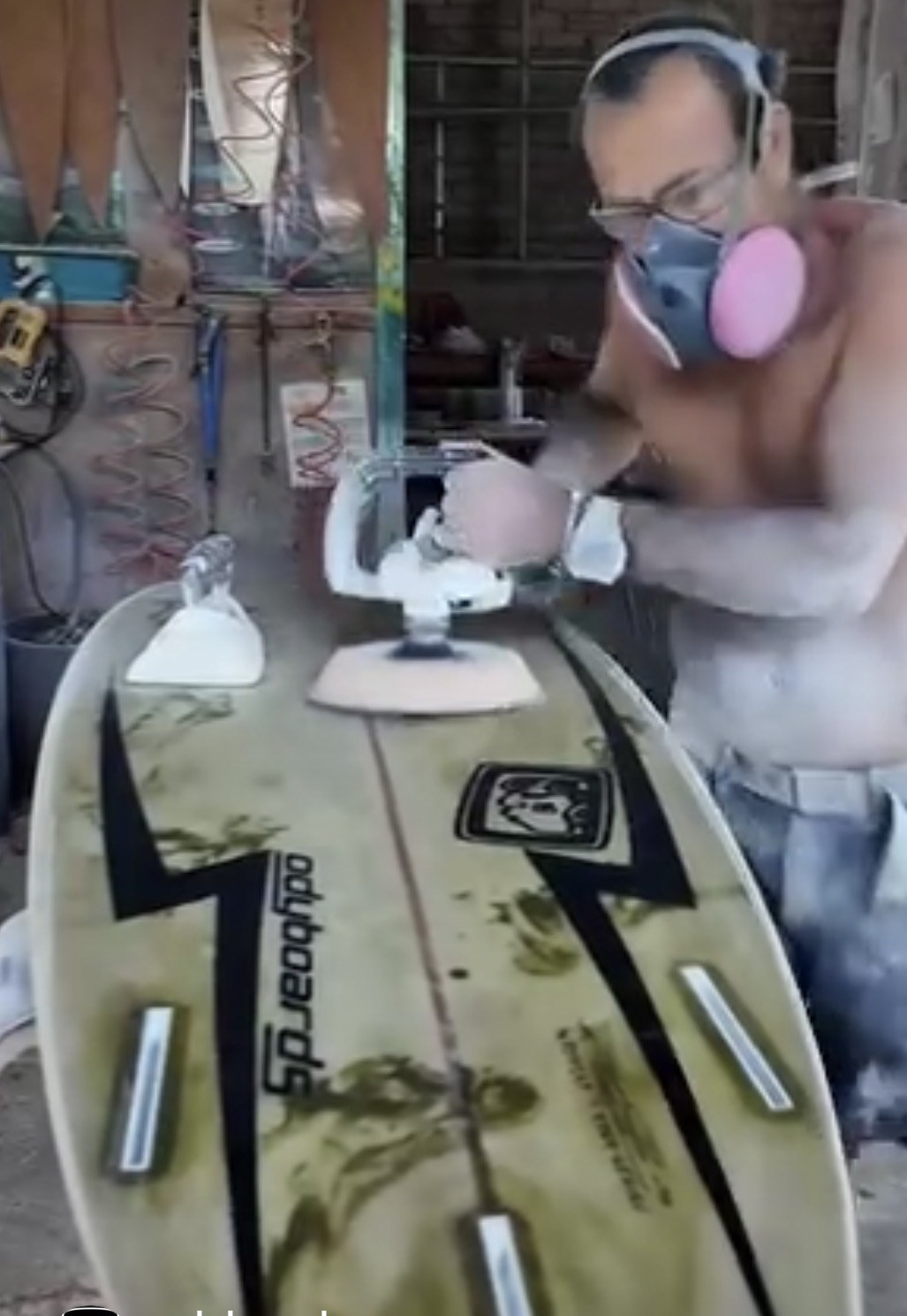 Glassing a board at the Odyboards factory