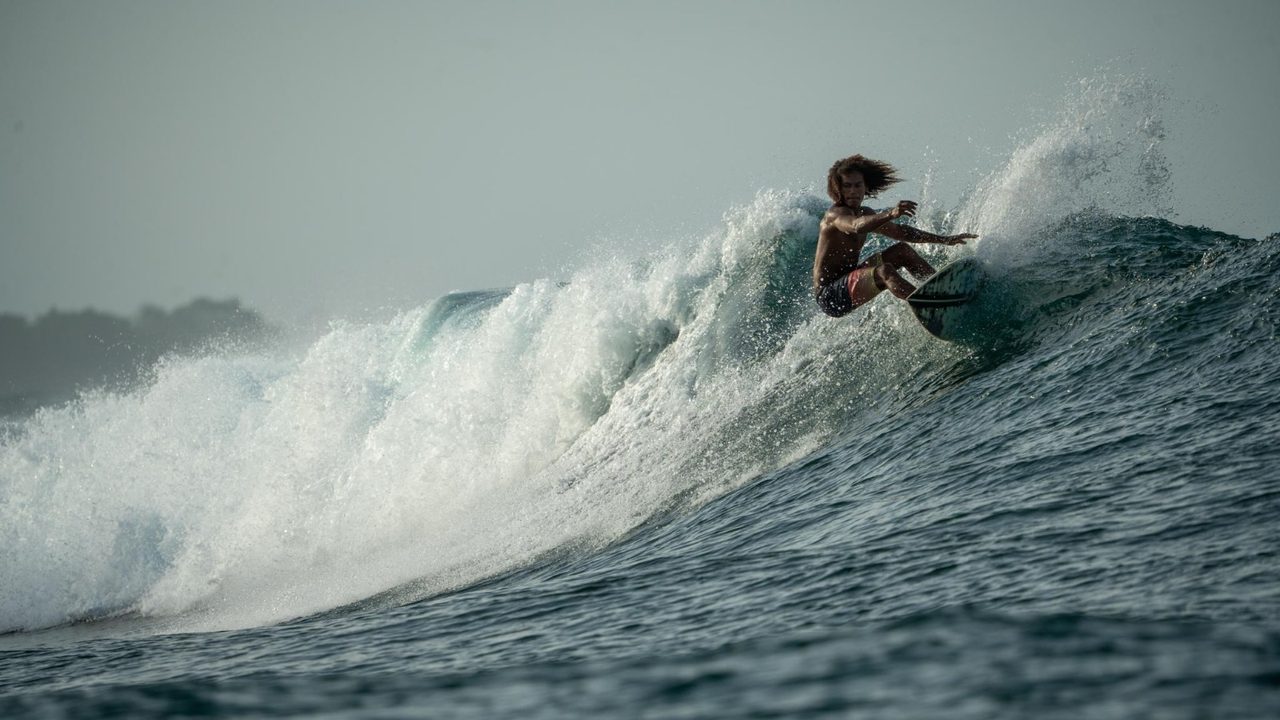 Surfer carving a big turn, shot by Bocas Is Love