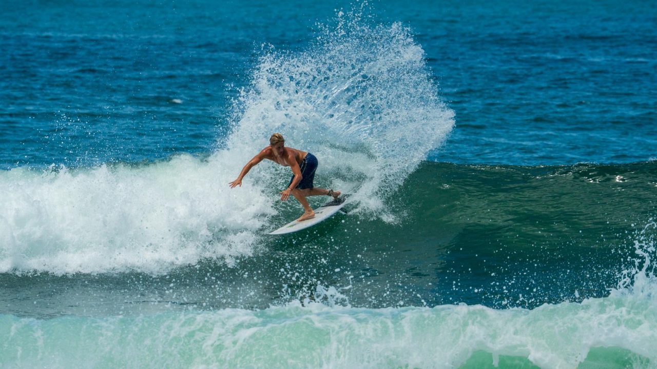 Surfer catching air on a snap, shot by Bocas Is Love