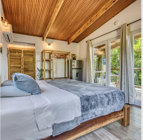 Bedroom interior of a Bocas Stoked Monkeys jungle cabin