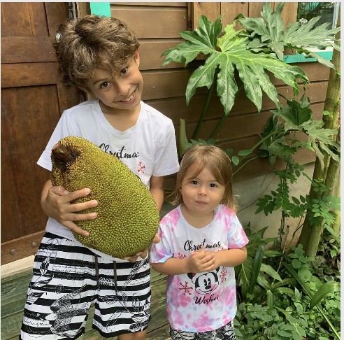Kids with a jackfruit at Bocas Stoked Monkeys