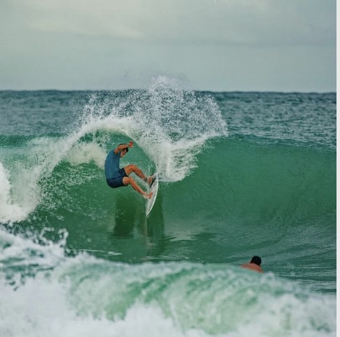 Surfer exiting a wave near Bocas Stoked Monkeys